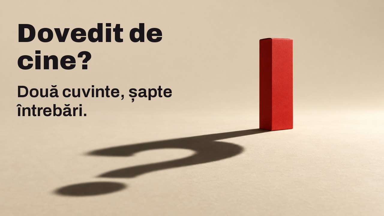 Dovedit de cine? Două cuvinte, șapte întrebări. O cutie simplă, roșie și mată, fără nicio literă, stă pe o podea caldă, de culoare crem, sub un singur reflector puternic și jos; umbra ei lungă și clară pe podea formează un semn de întrebare.