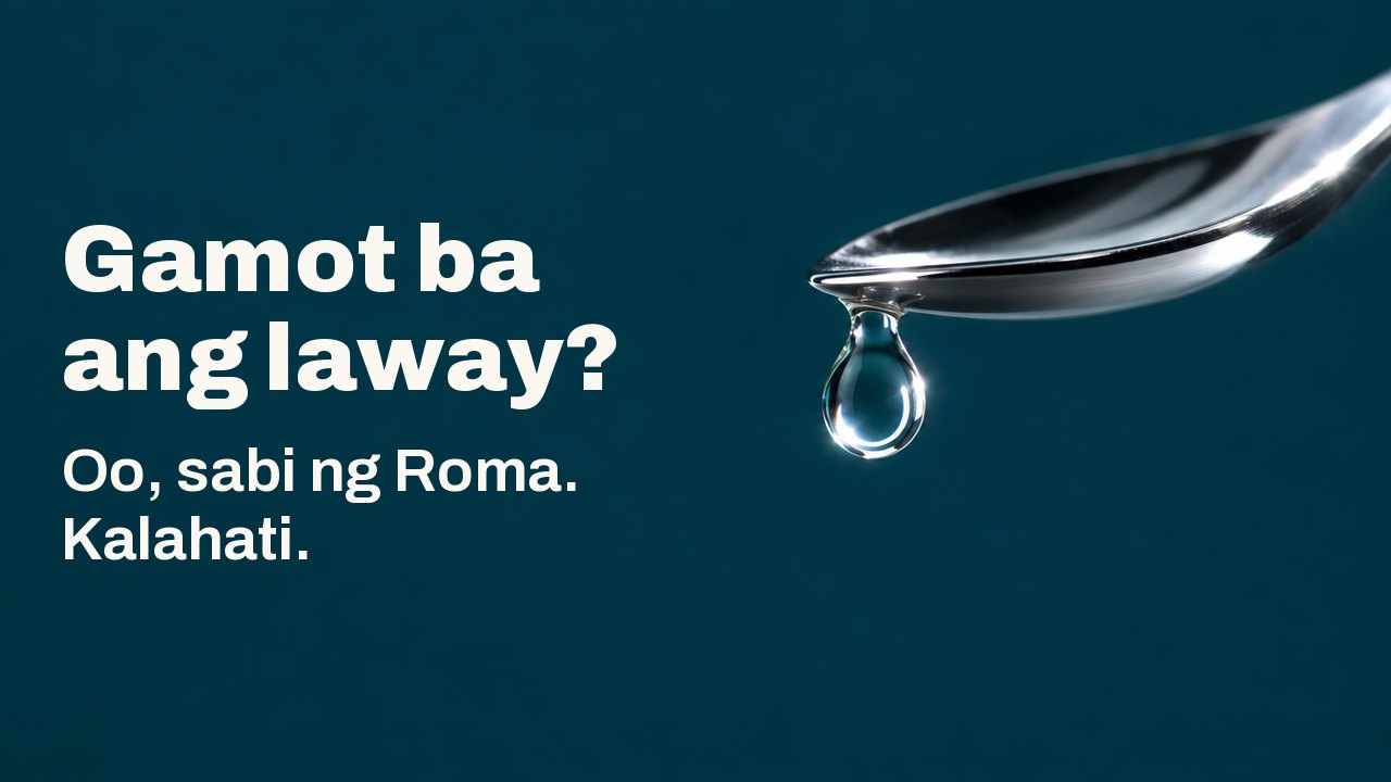 Gamot ba ang laway? Oo, sabi ng Roma. Kalahati. Isang malinaw na patak ng likido ang nakabitin sa dulo ng makintab na pilak na kutsara sa ibabaw ng malalim na teal na background, may maliwanag na bilog ng liwanag sa loob ng patak.