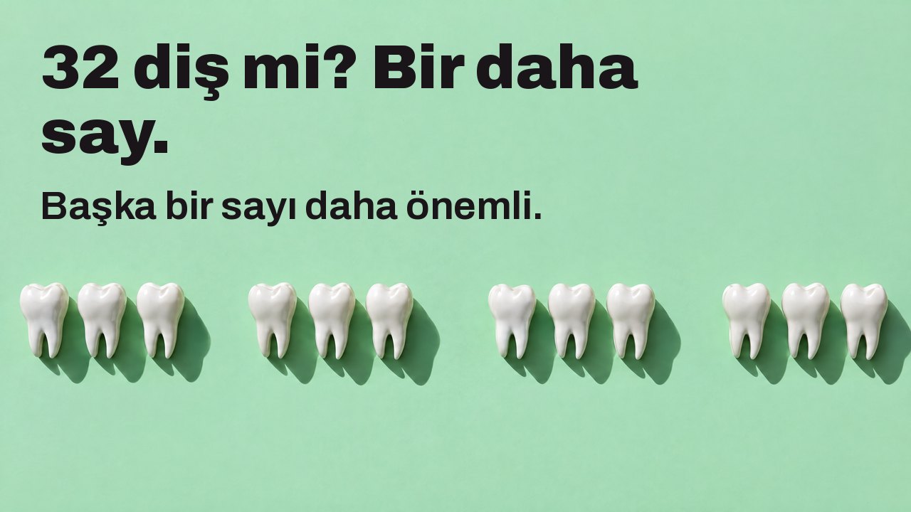 32 diş mi? Bir daha say. Başka bir sayı daha önemli. Yukarıdan: nane yeşili üzerinde beyaz diş heykelciklerinden bir sıra, eksik dişlerin yerinde boşluklar.