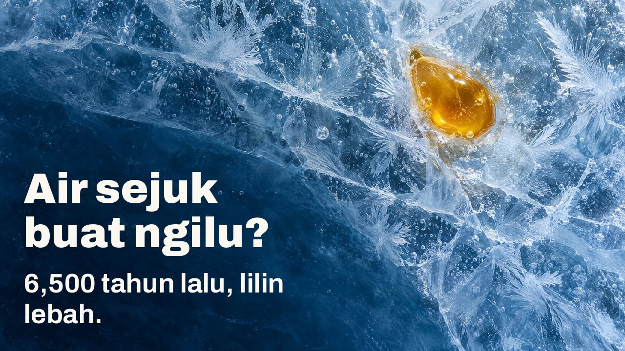 Air sejuk buat ngilu? 6,500 tahun lalu, lilin lebah. Dari atas: setitis lilin lebah keemasan membeku di dalam ais biru yang retak, dengan kristal fros dan gelembung udara.